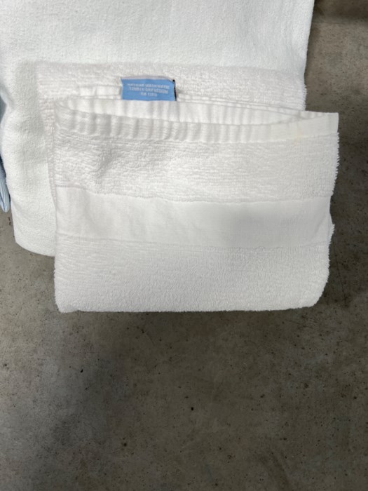 (2) Bags of Hospital Towels, Sheets, and Gowns for sale