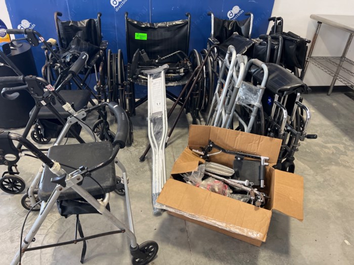 Assorted wheelchairs, walkers, canes and a pair of crutches for sale