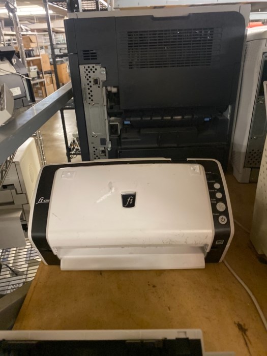 Large aisle (front and back) of printers and copiers for sale
