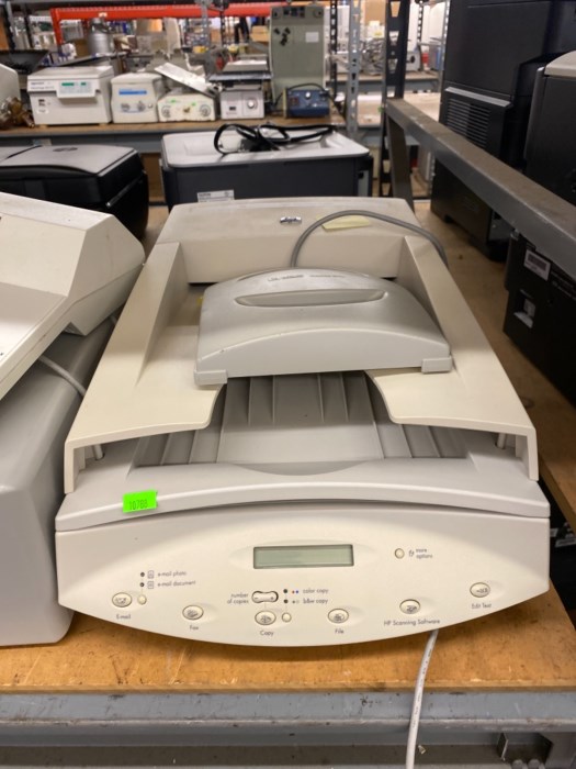Large aisle (front and back) of printers and copiers for sale