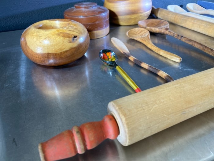 Selection of wooden kitchen utensils including some from the